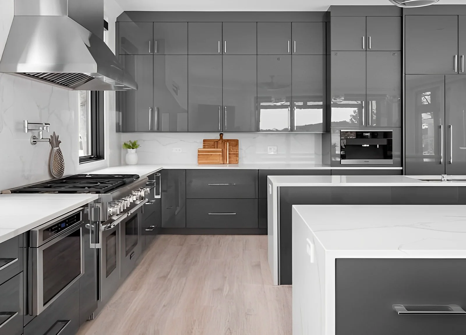 High-gloss contemporary gray kitchen cabinets with quartz countertops