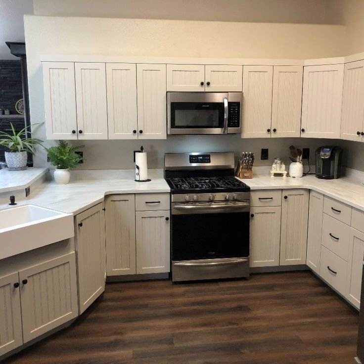 Modern white shaker custom kitchen cabinets with quartz island
