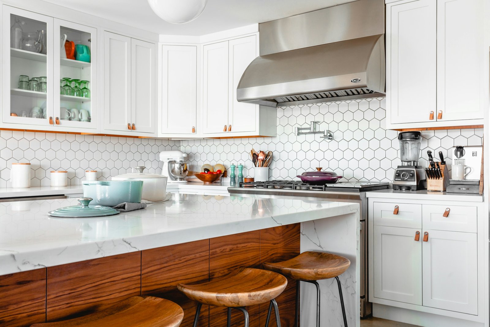 Custom white shaker kitchen cabinets with wood island and quartz countertop installed in Kitchener, Ontario