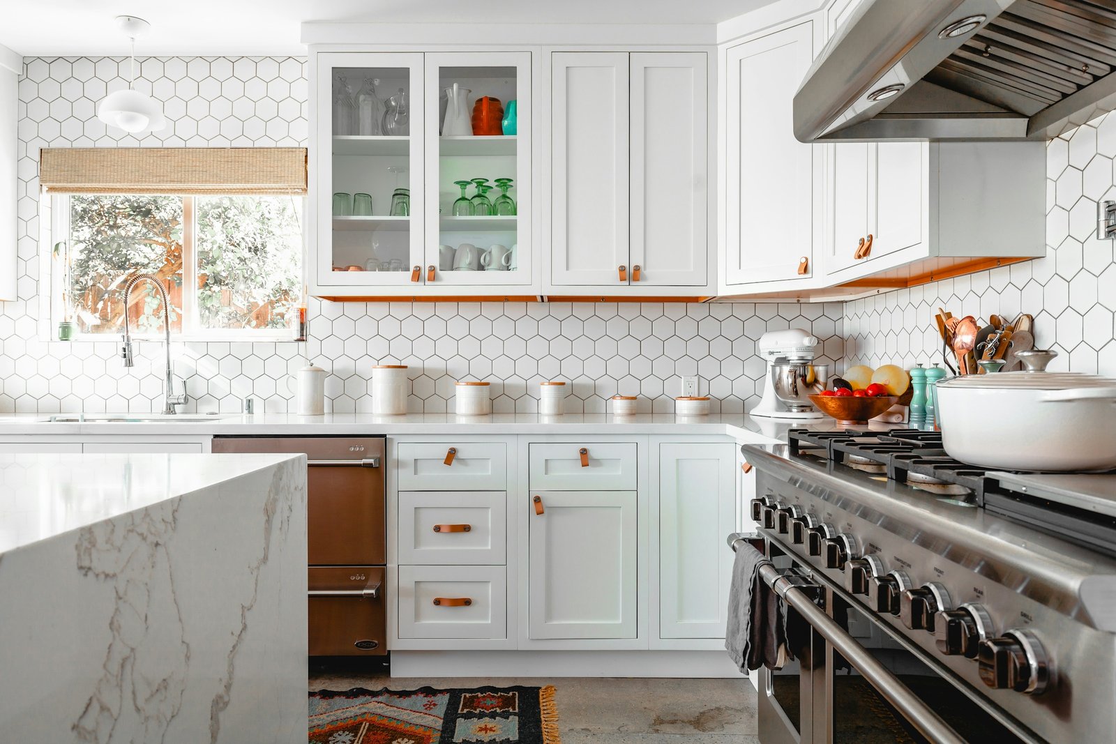 Modern grey and white custom kitchen cabinets with stone island installed in Kitchener, Ontario